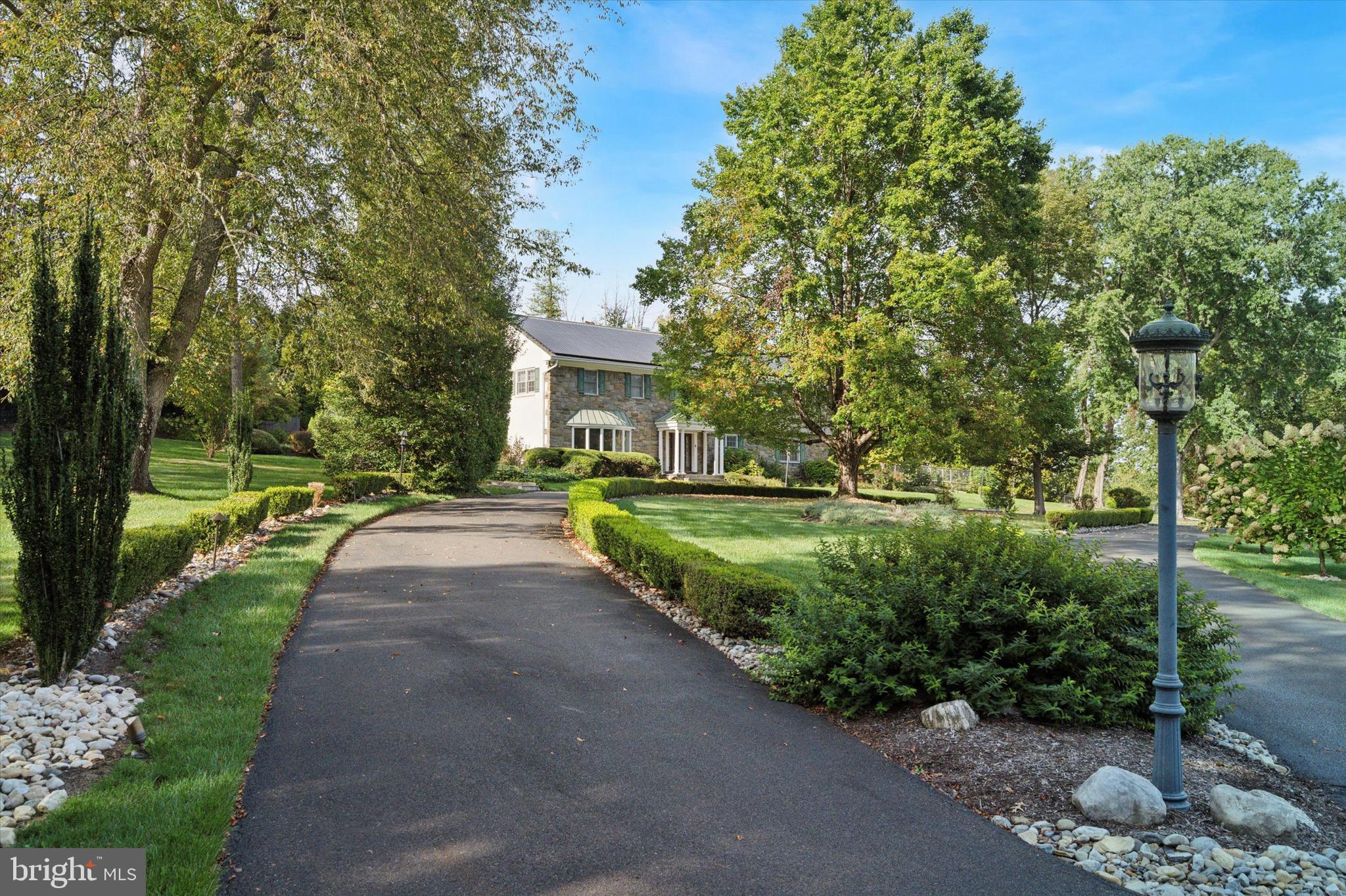 1087 Mt Eyre Road Washington Crossing, PA 18977 - Photo 4 of 77 a front view of a house with a yard