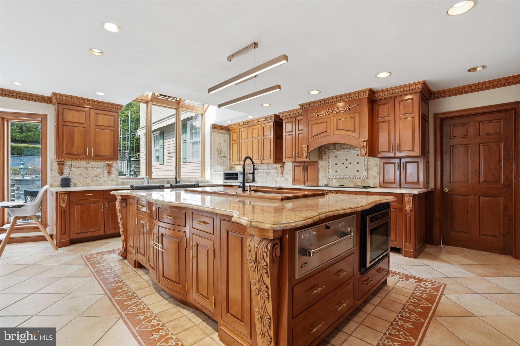 1087 Mt Eyre Road Washington Crossing, PA 18977 - Photo 45 of 77 Elegant kitchen with rich wood cabinetry.