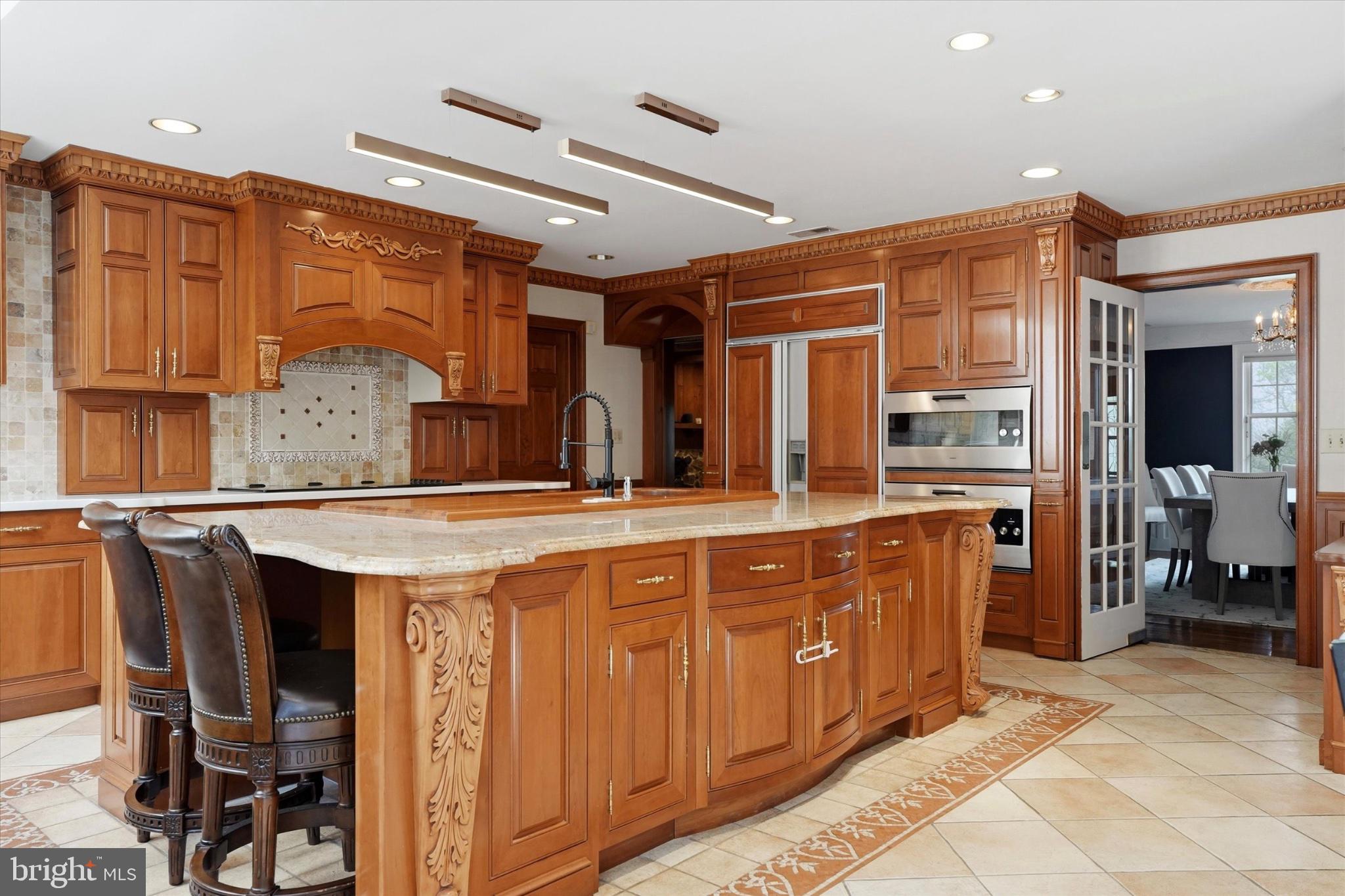 1087 Mt Eyre Road Washington Crossing, PA 18977 - Photo 50 of 77 Elegant kitchen with rich wood finishes.