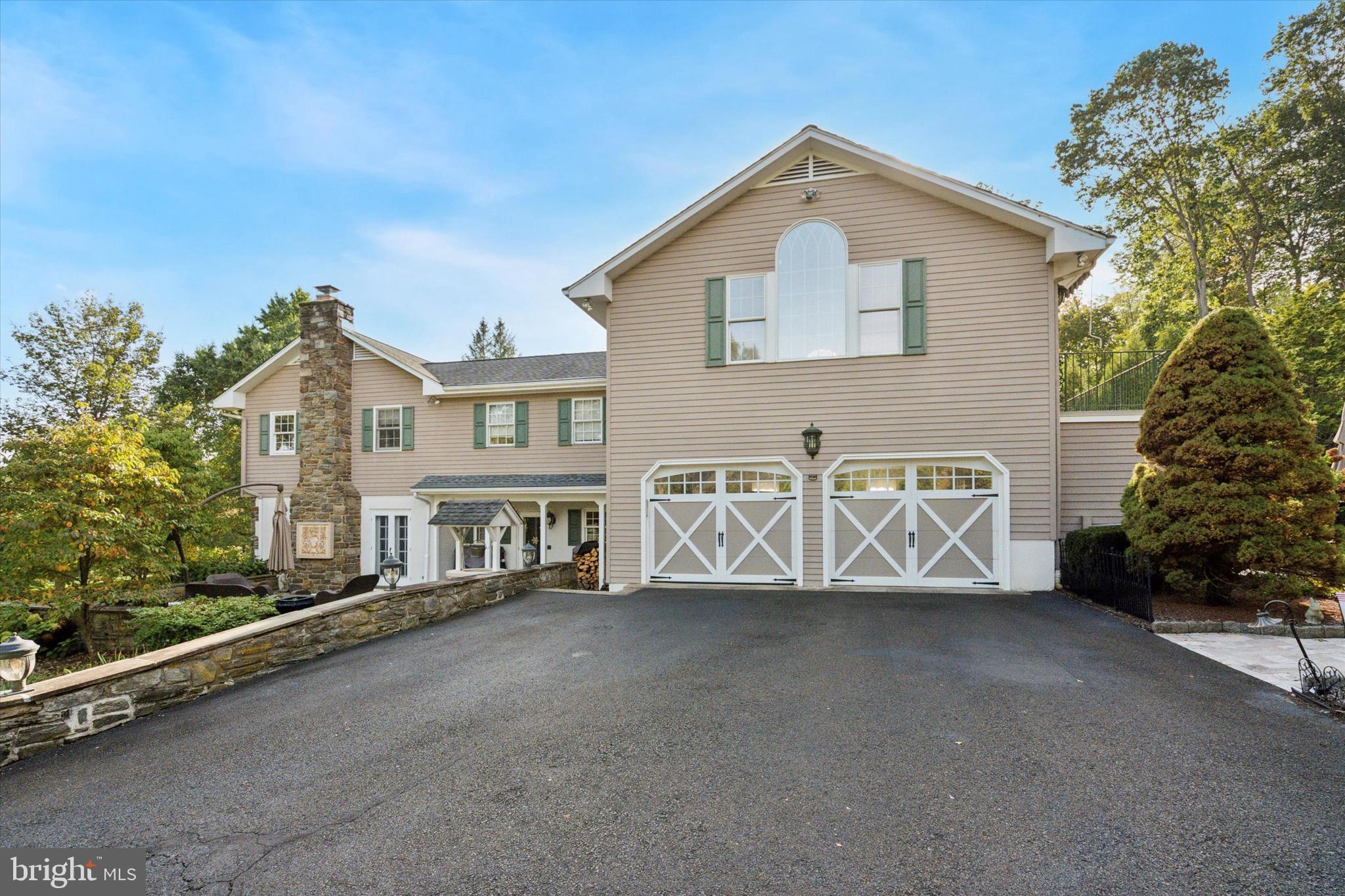 1087 Mt Eyre Road Washington Crossing, PA 18977 - Photo 69 of 77 a front view of a house with a yard and garage