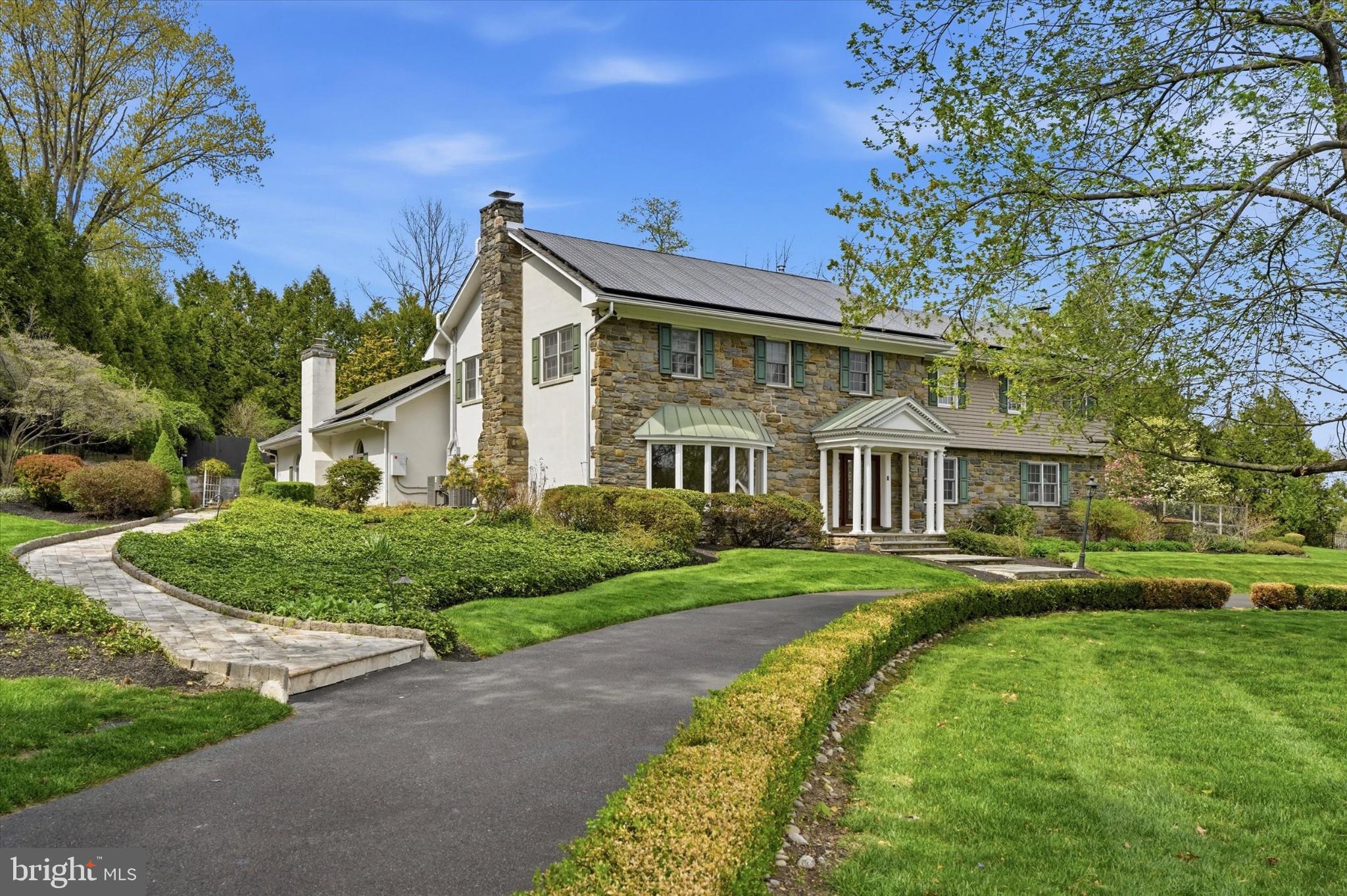 1087 Mt Eyre Road Washington Crossing, PA 18977 - Photo 7 of 77 Elegant stone home with lush landscaping.
