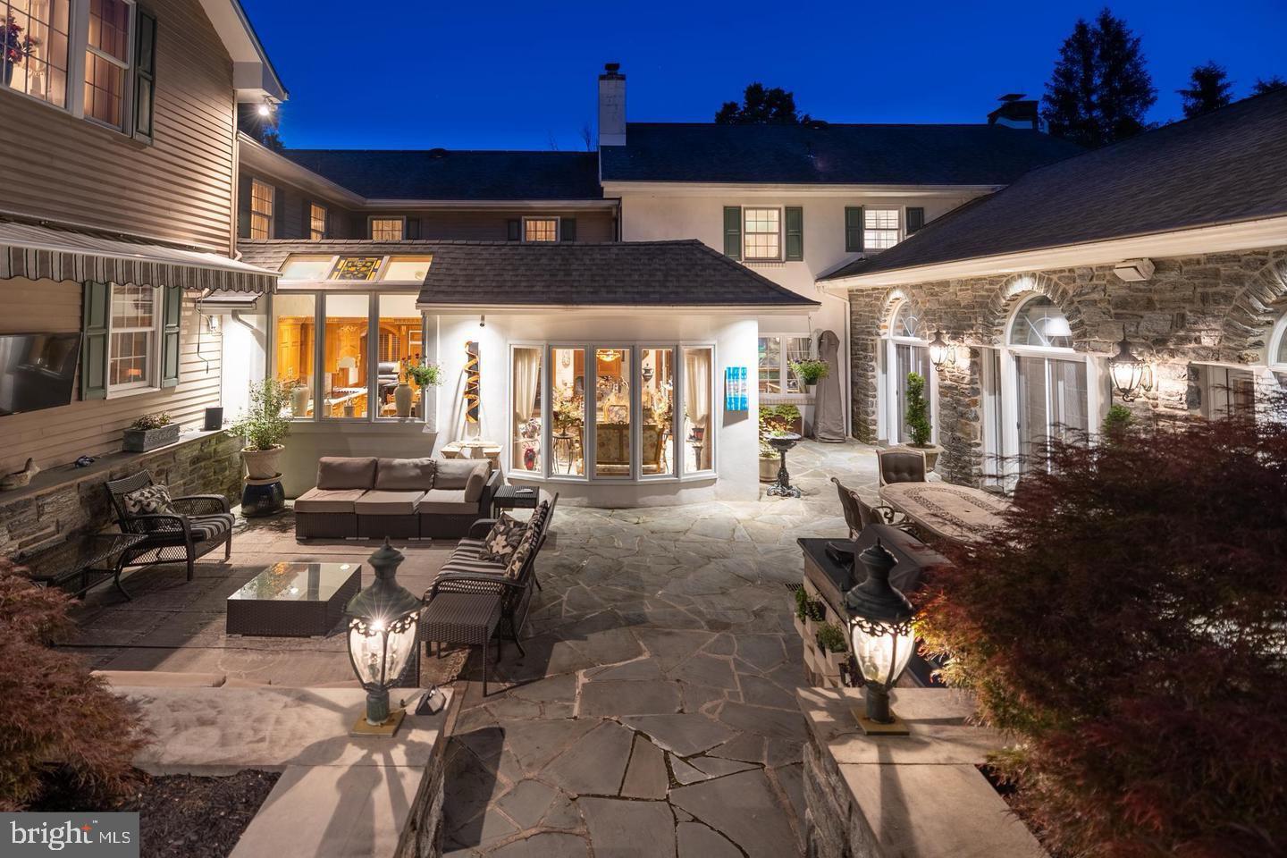 1087 Mt Eyre Road Washington Crossing, PA 18977 - Photo 71 of 77 a view of a patio with table and chairs potted plants and large tree