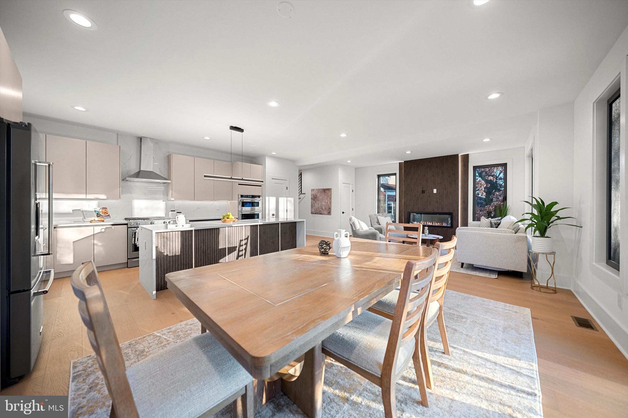 2100 South Nelson Street Arlington, VA 22204 - Photo 12 of 33 a dining room with kitchen island a table and chairs