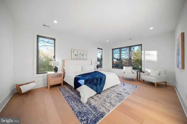 a dining room with kitchen island a table and chairs