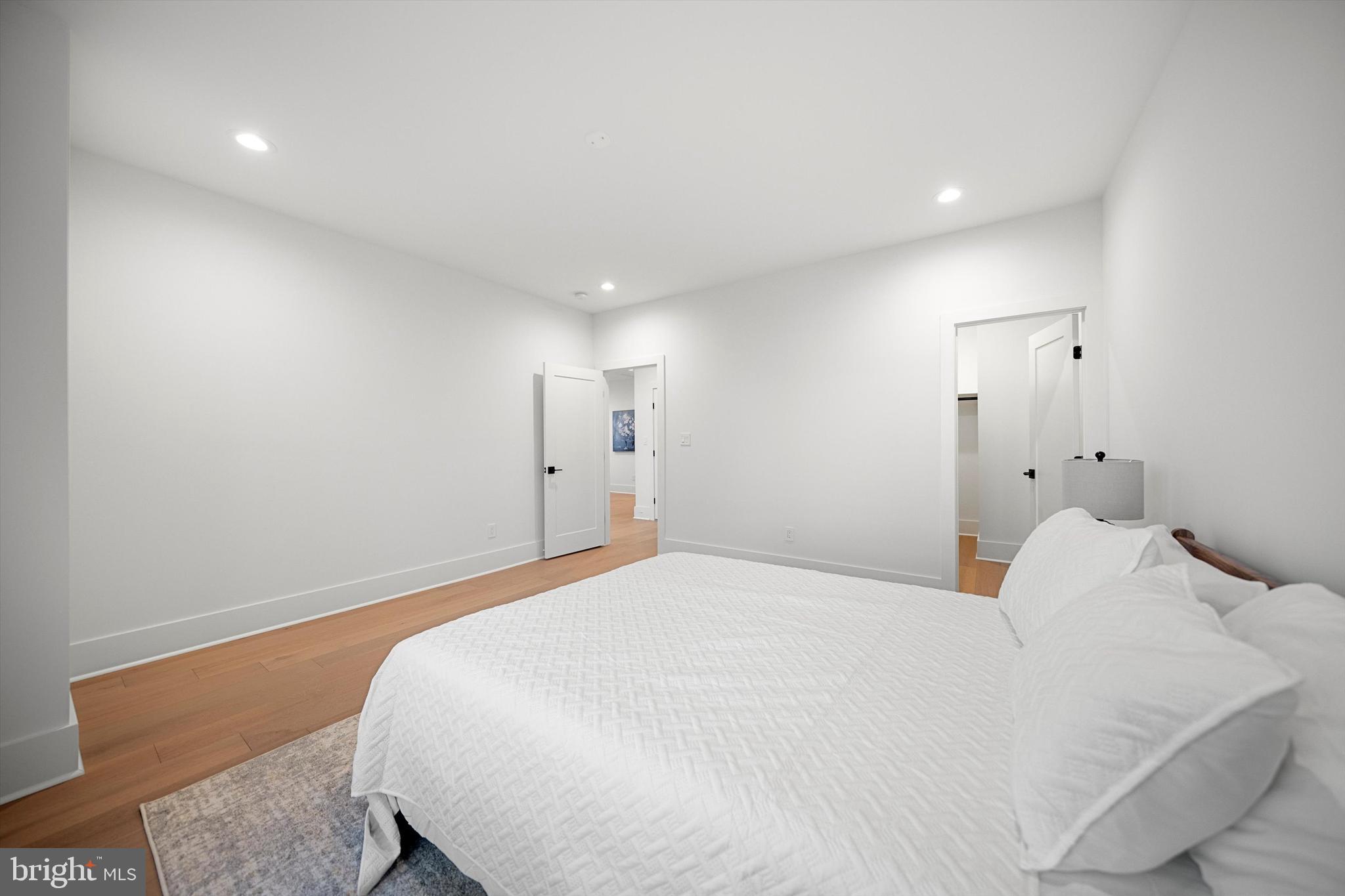 2100 South Nelson Street Arlington, VA 22204 - Photo 21 of 33 a large white bed in a white room