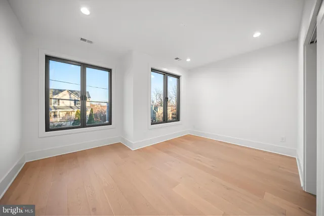 a large white bed in a white room