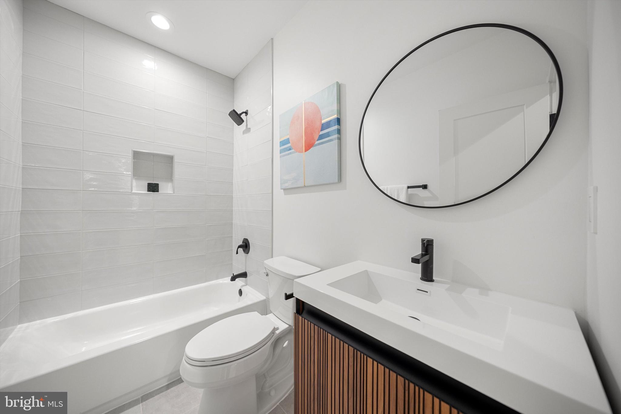 2100 South Nelson Street Arlington, VA 22204 - Photo 27 of 33 a bathroom with a sink a toilet and a mirror