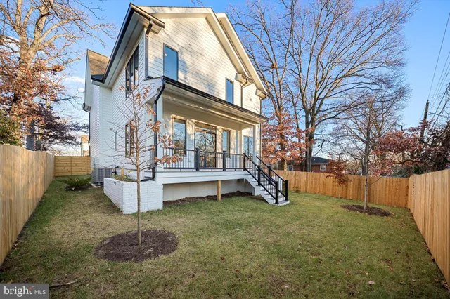 a view of deck with wooden floor and wooden fence