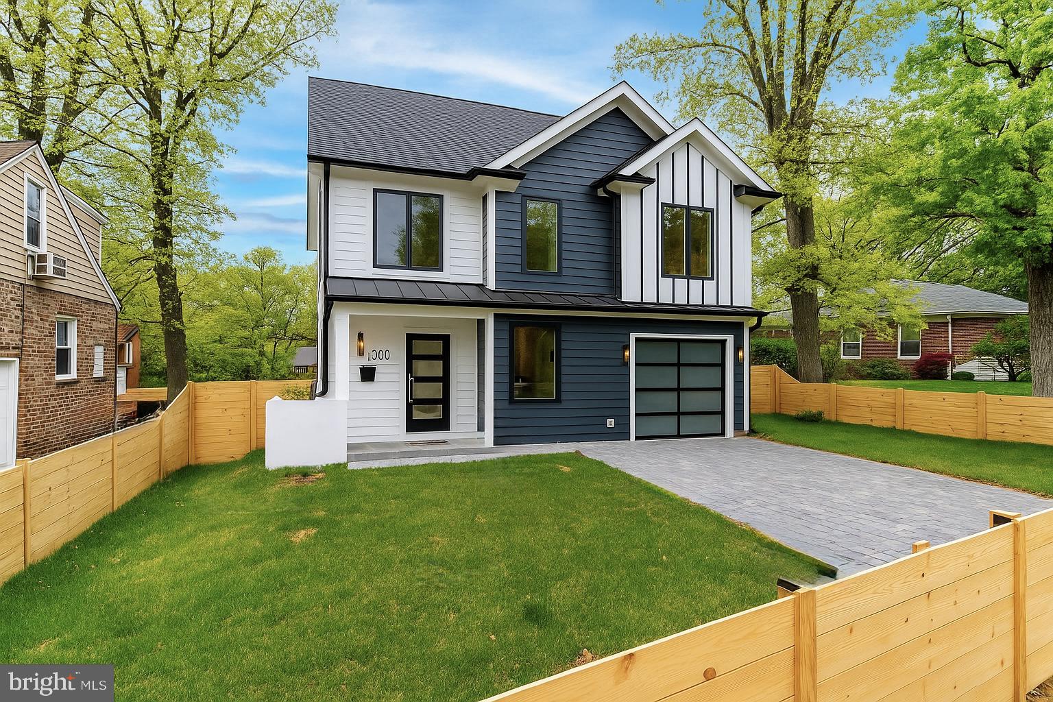 2100 South Nelson Street Arlington, VA 22204 - Photo 32 of 33 a front view of a house with a yard and trees