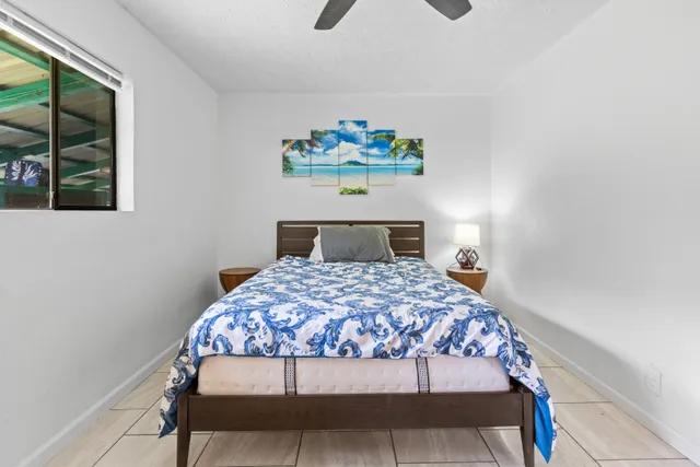 a bathroom with a bathtub shower sink and mirror