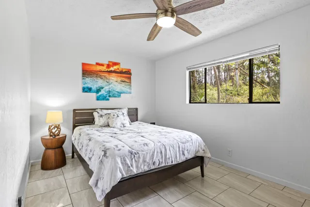 a view of a house with a backyard porch and sitting area