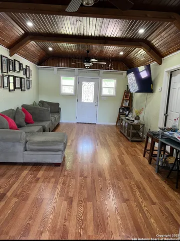 a kitchen with a table chairs and a dining table