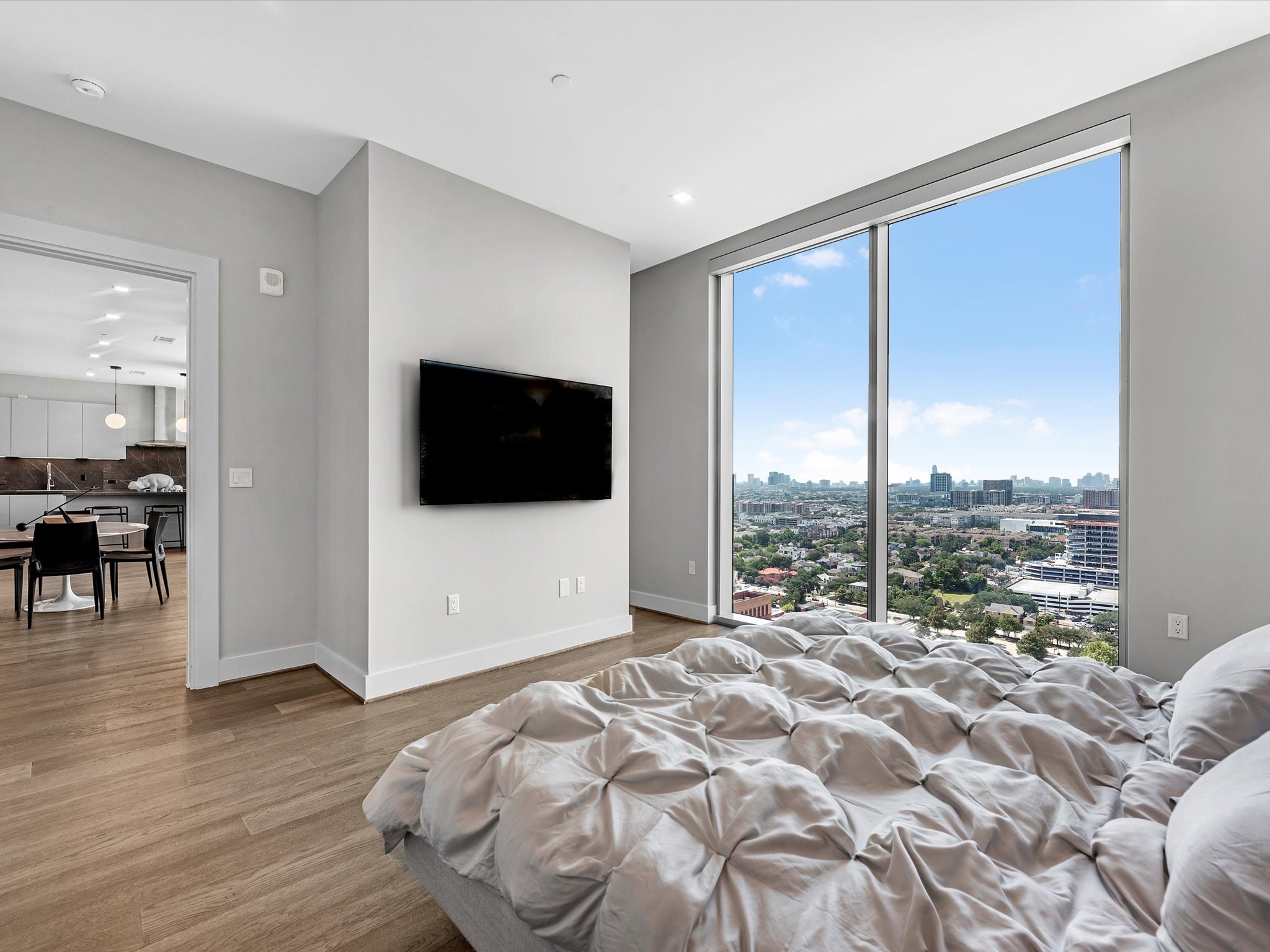 1711 Allen Parkway, Unit 2102 Houston, TX 77019 - Photo 9 of 17 a living room with a large window and a wooden floor