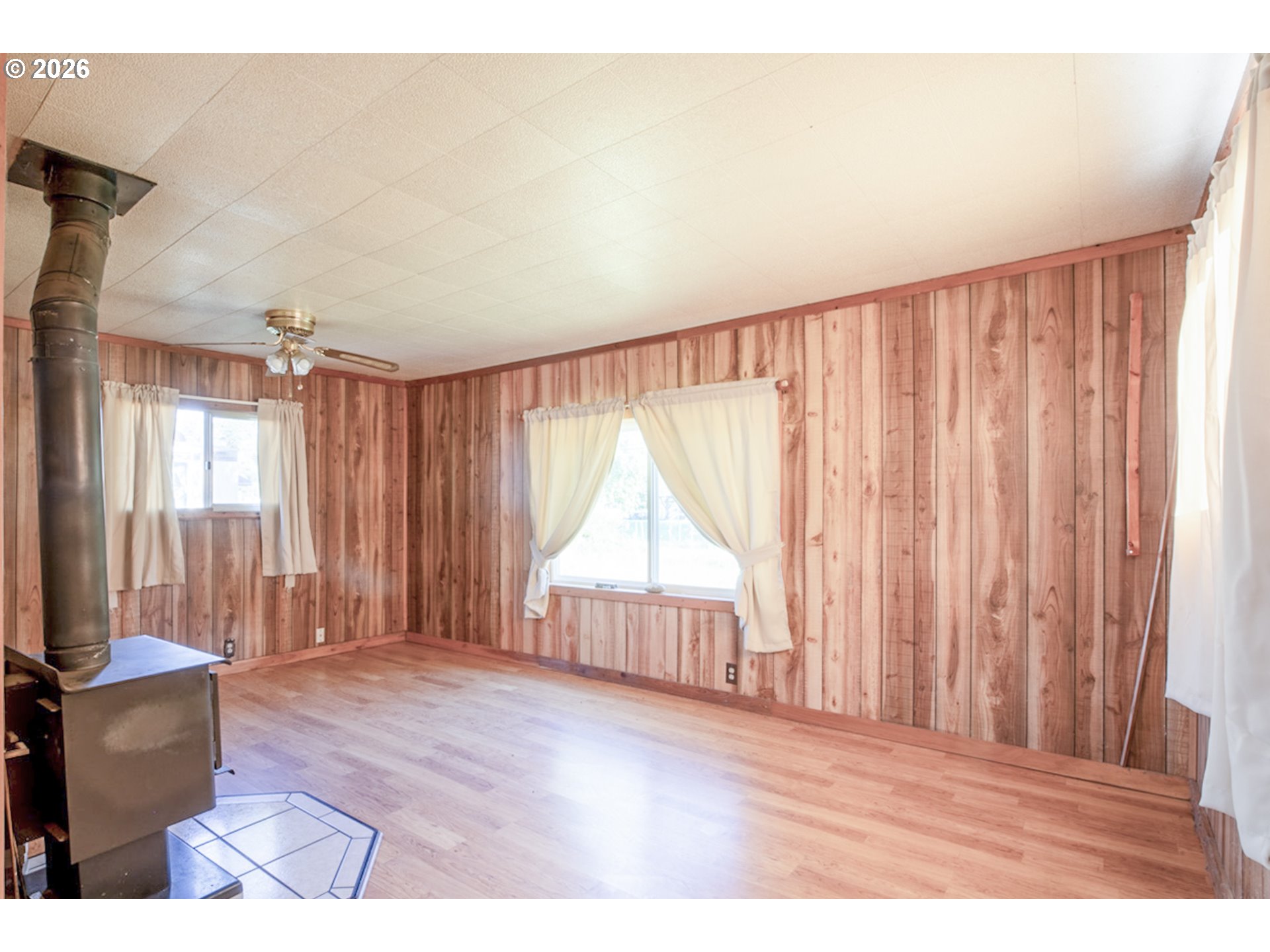 47433 School Street Oakridge, OR 97463 - Photo 3 of 16 a view of an empty room with a window