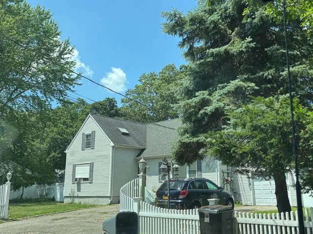 a view of a house and a yard