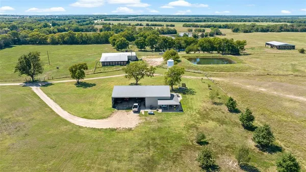 an aerial view of a house with a lake view