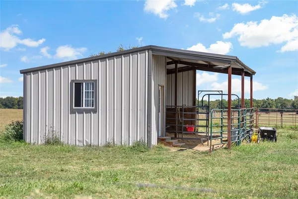 a backyard of a house with swimming pool table and chairs