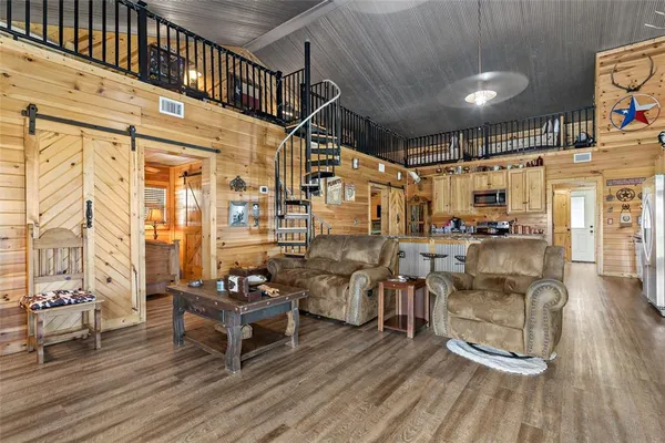 a outdoor living space with patio furniture and a wooden floor