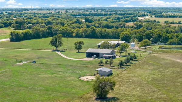 a view of a lake with a yard