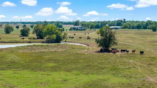 a view of a large body of water with a building in the background