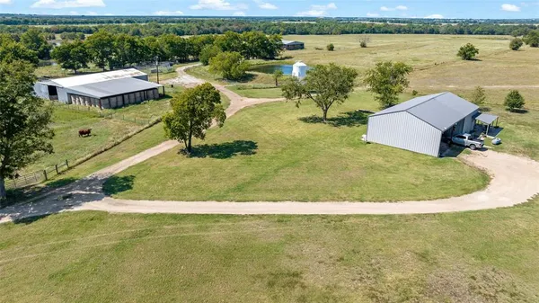 an aerial view of residential houses with outdoor space