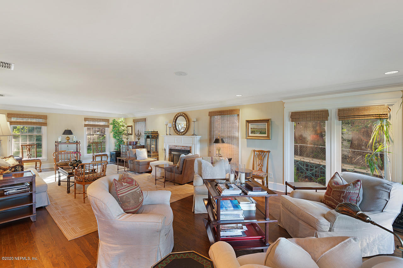 5015 River Point Road Jacksonville, FL 32207 - Photo 13 of 49 a living room with furniture and a large window