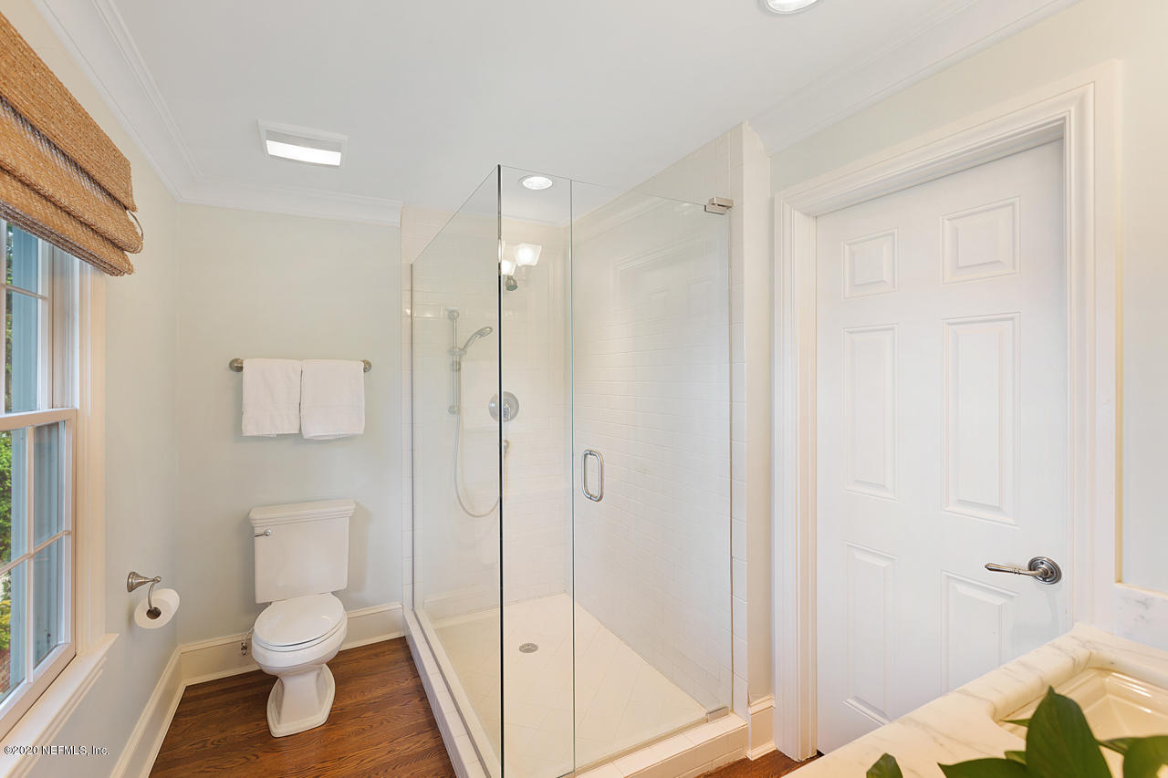 5015 River Point Road Jacksonville, FL 32207 - Photo 18 of 49 a bathroom with a shower and a toilet