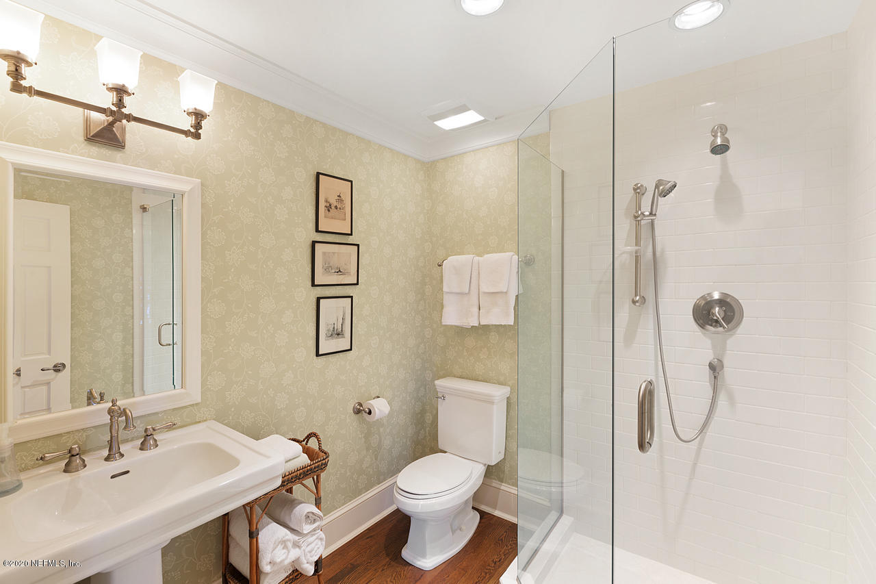 5015 River Point Road Jacksonville, FL 32207 - Photo 23 of 49 a bathroom with a sink toilet and shower