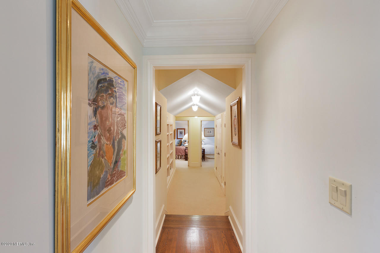 5015 River Point Road Jacksonville, FL 32207 - Photo 24 of 49 a view of a hallway view with wooden floor and living room