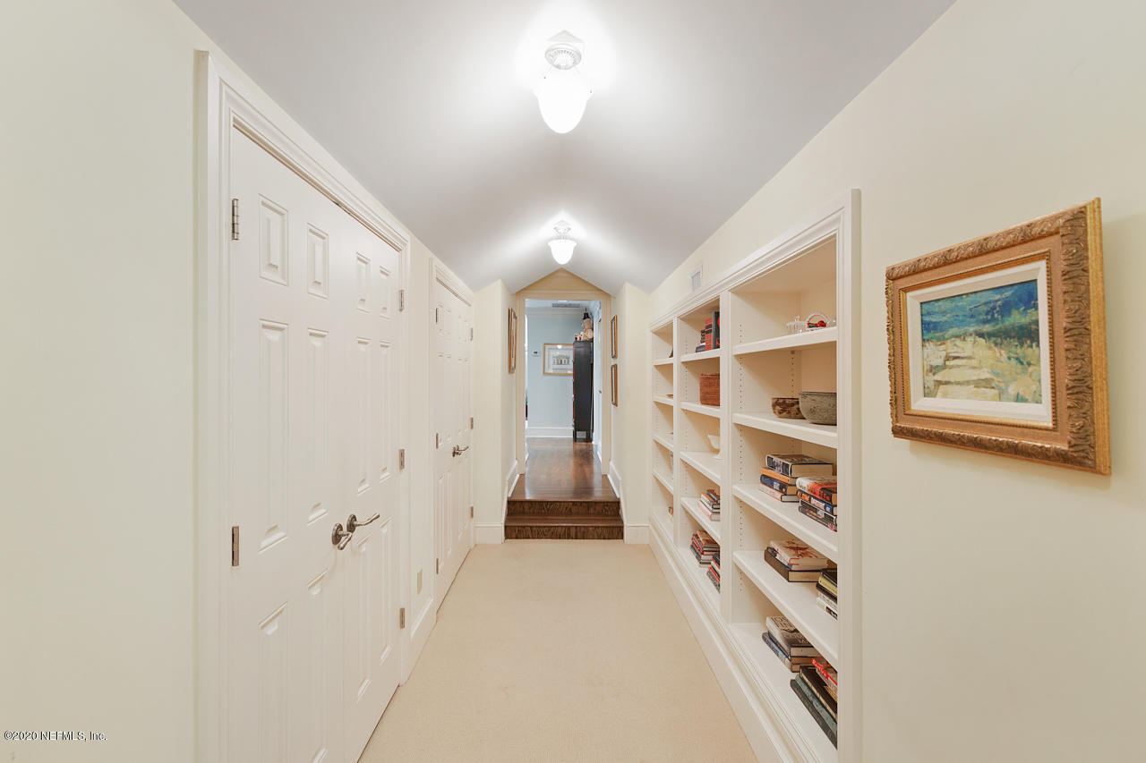 5015 River Point Road Jacksonville, FL 32207 - Photo 25 of 49 a view of a hallway with wooden floor and windows