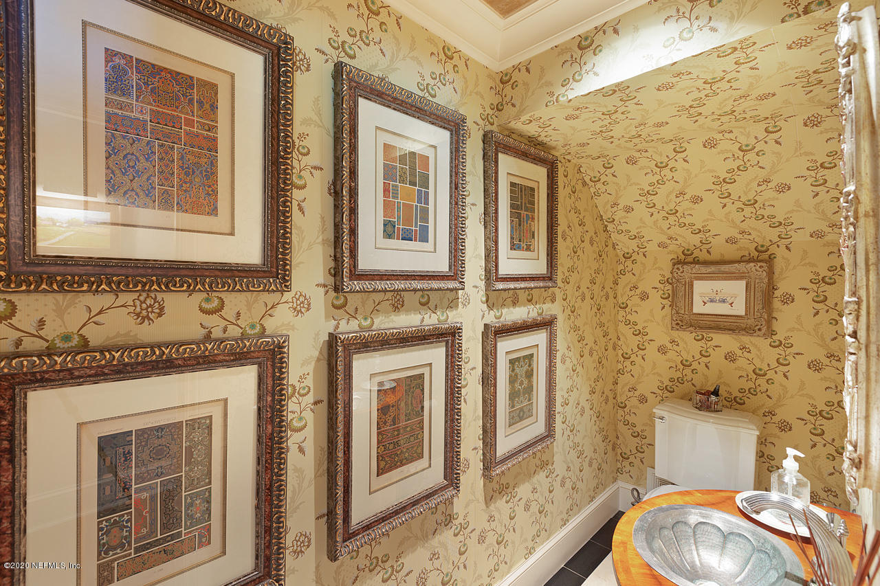 5015 River Point Road Jacksonville, FL 32207 - Photo 33 of 49 a bathroom with a granite countertop toilet sink and mirror