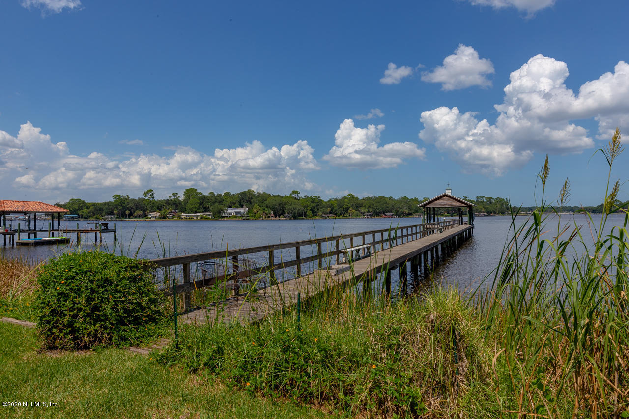 5015 River Point Road Jacksonville, FL 32207 - Photo 39 of 49 a view of a lake with a garden