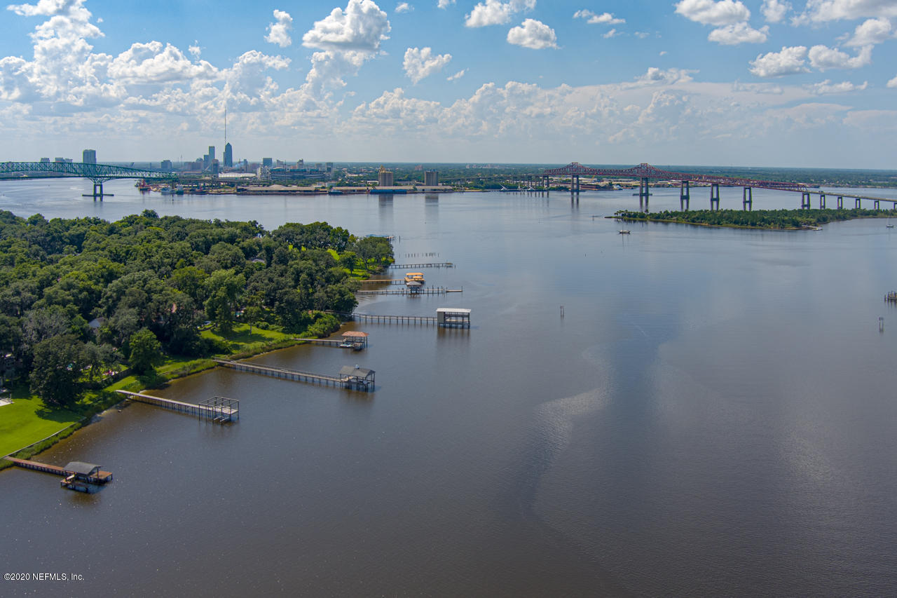 5015 River Point Road Jacksonville, FL 32207 - Photo 46 of 49 an aerial view of a house with a yard and lake view