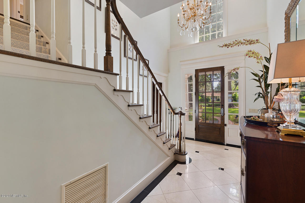 5015 River Point Road Jacksonville, FL 32207 - Photo 7 of 49 a view of entryway and hall with wooden floor