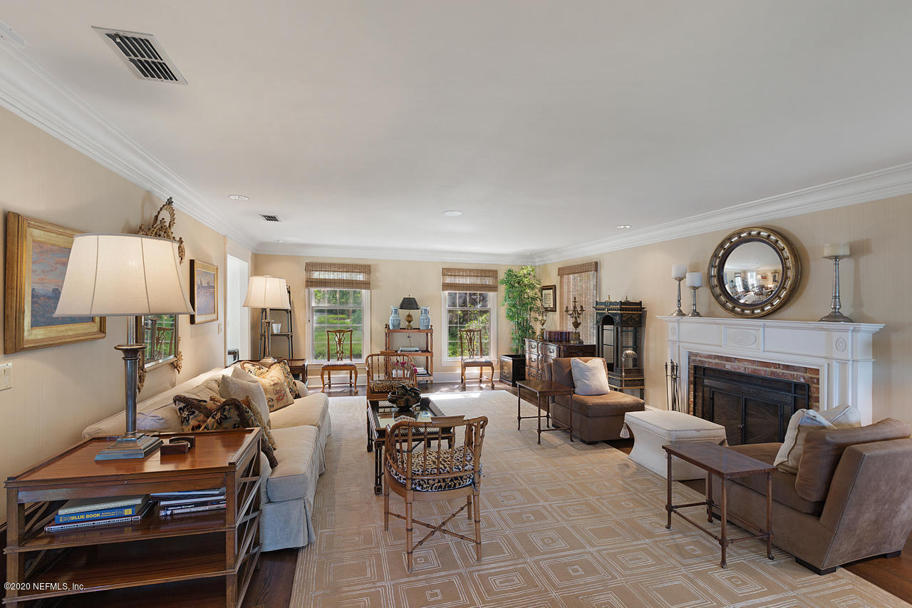 5015 River Point Road Jacksonville, FL 32207 - Photo 9 of 49 a living room with furniture fireplace and a large window