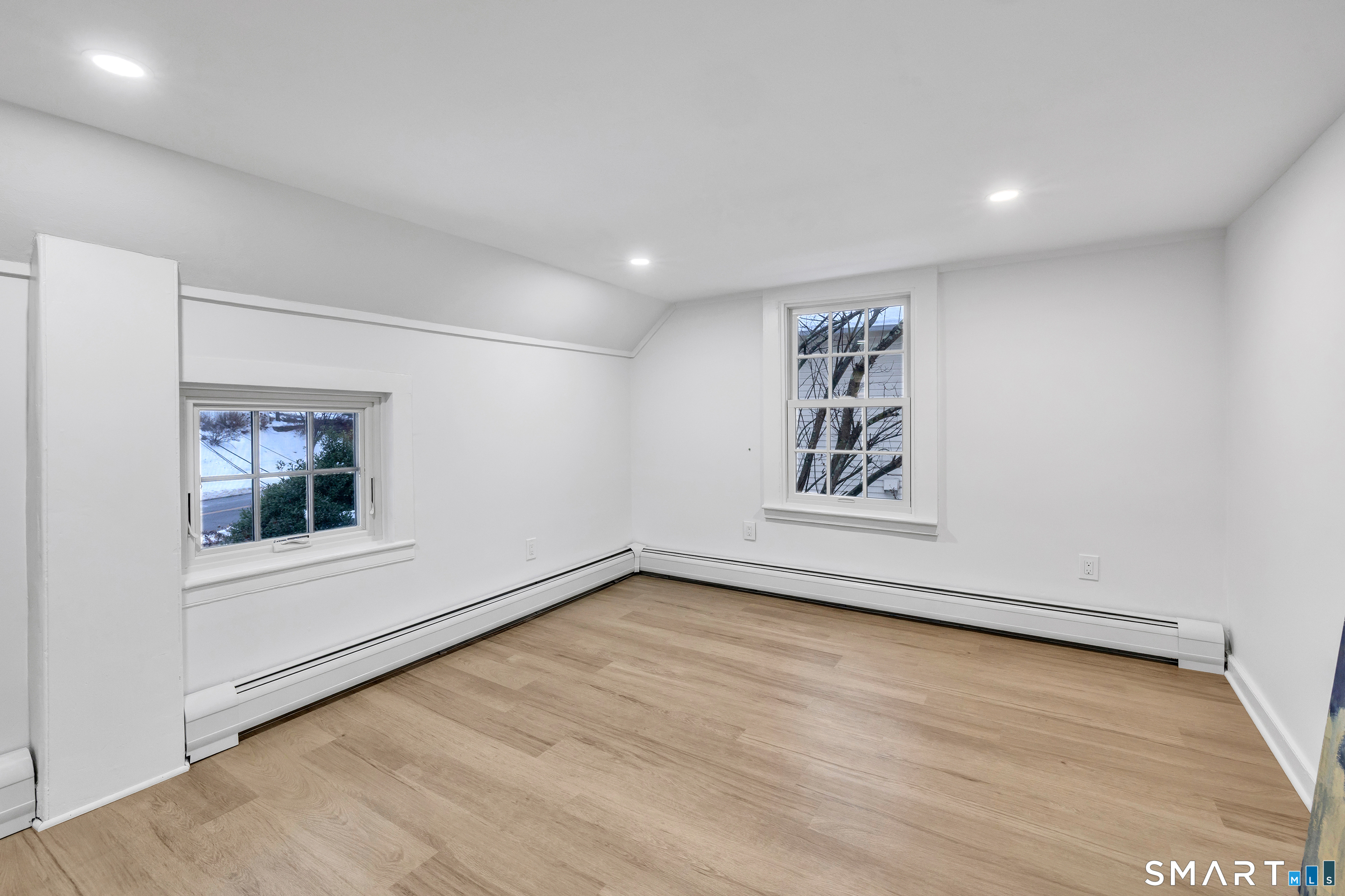 315 Main Street Westport, CT 06880 - Photo 13 of 19 a view of an empty room with a window and wooden floor