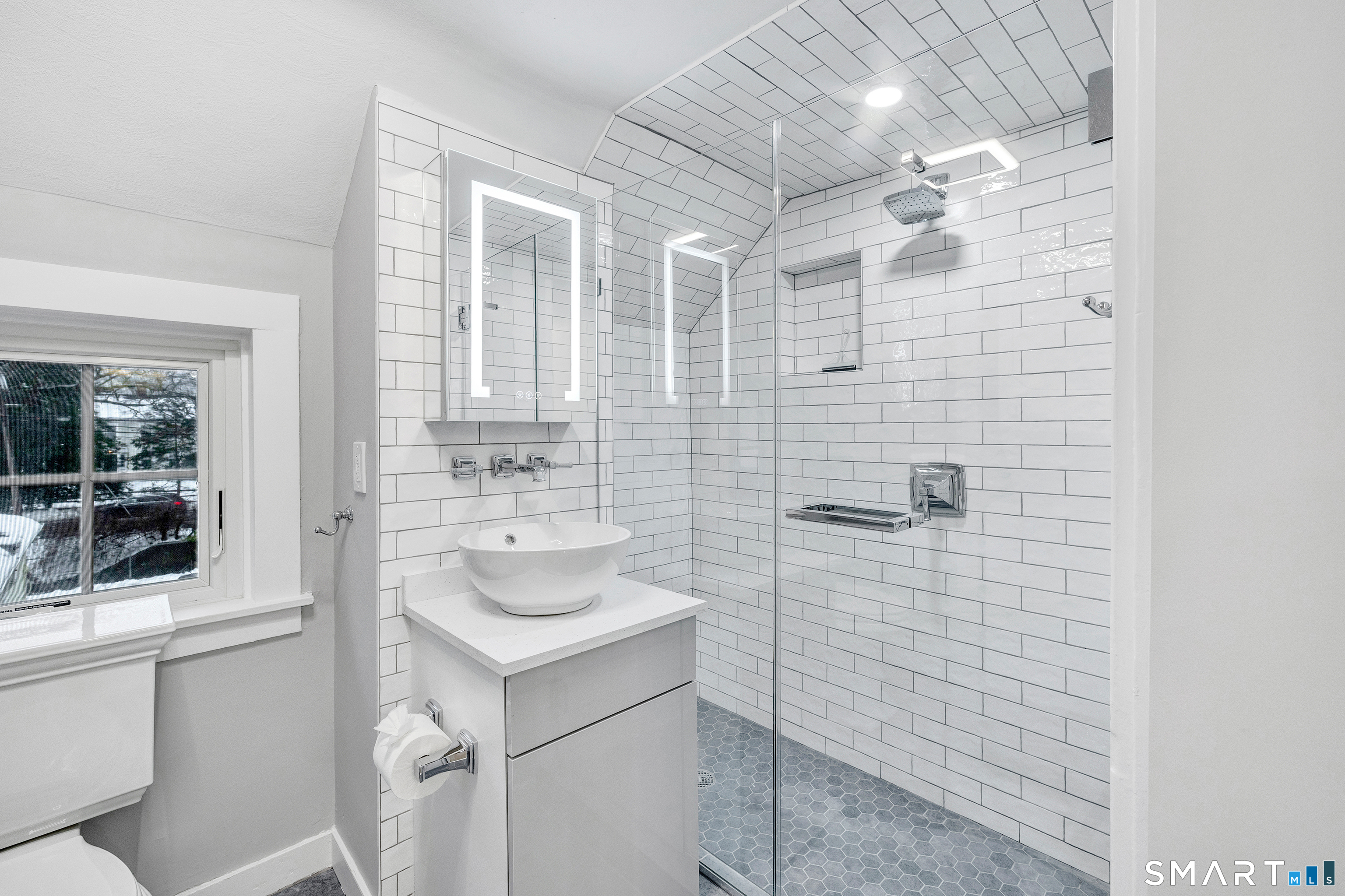 315 Main Street Westport, CT 06880 - Photo 15 of 19 a bathroom with a sink a toilet and shower