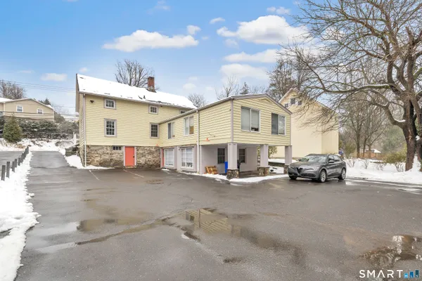 a view of a house with a street
