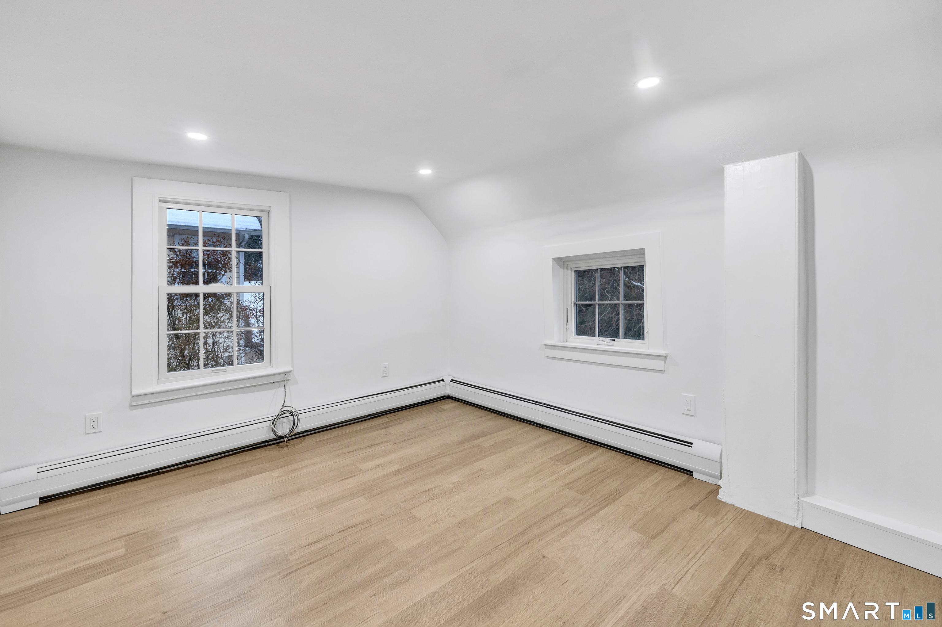 315 Main Street Westport, CT 06880 - Photo 7 of 19 an empty room with wooden floor and windows