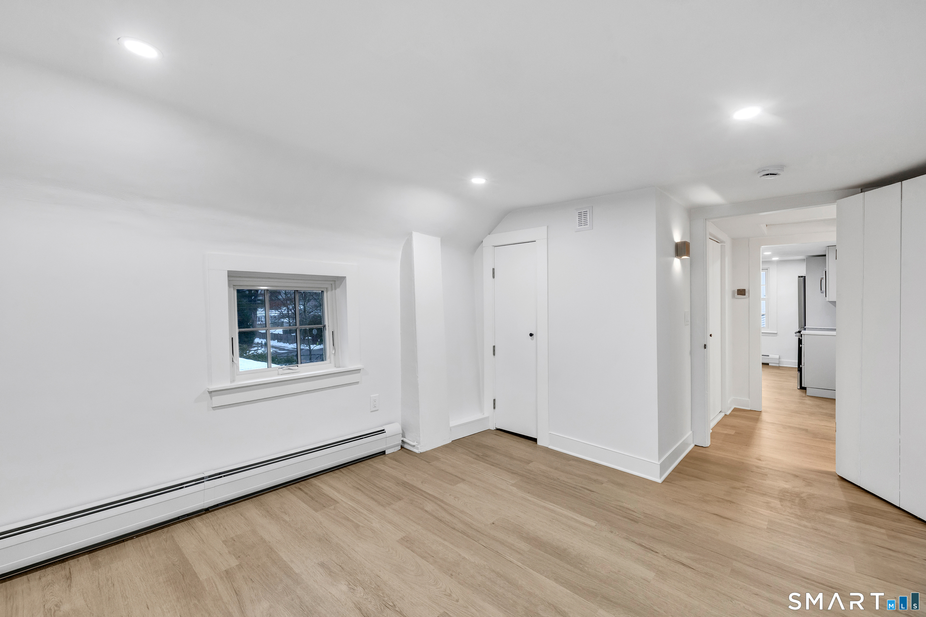 315 Main Street Westport, CT 06880 - Photo 8 of 19 a view of a big room with wooden floor and windows