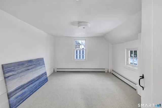 a view of a livingroom with an empty space and workspace