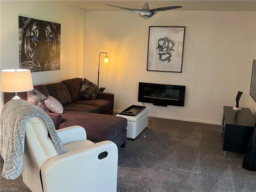 348 Tern Drive, Unit 2 Naples, FL 34112 - Photo 14 of 28 a living room with furniture and a couch