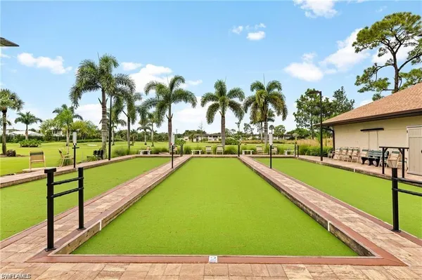 a view of swimming pool with outdoor seating