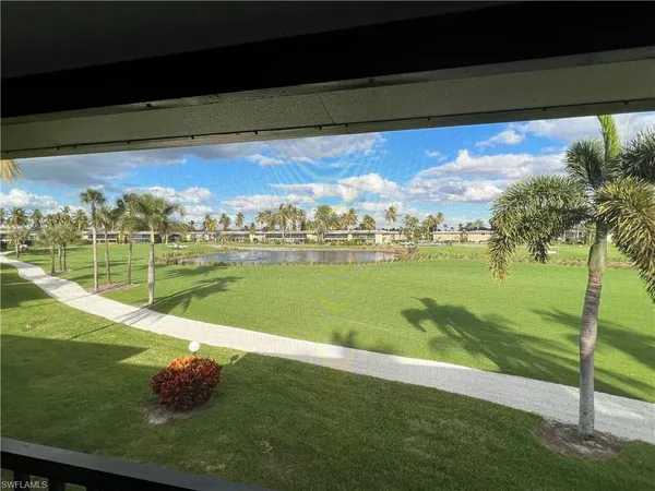 a view of a lake with a big yard