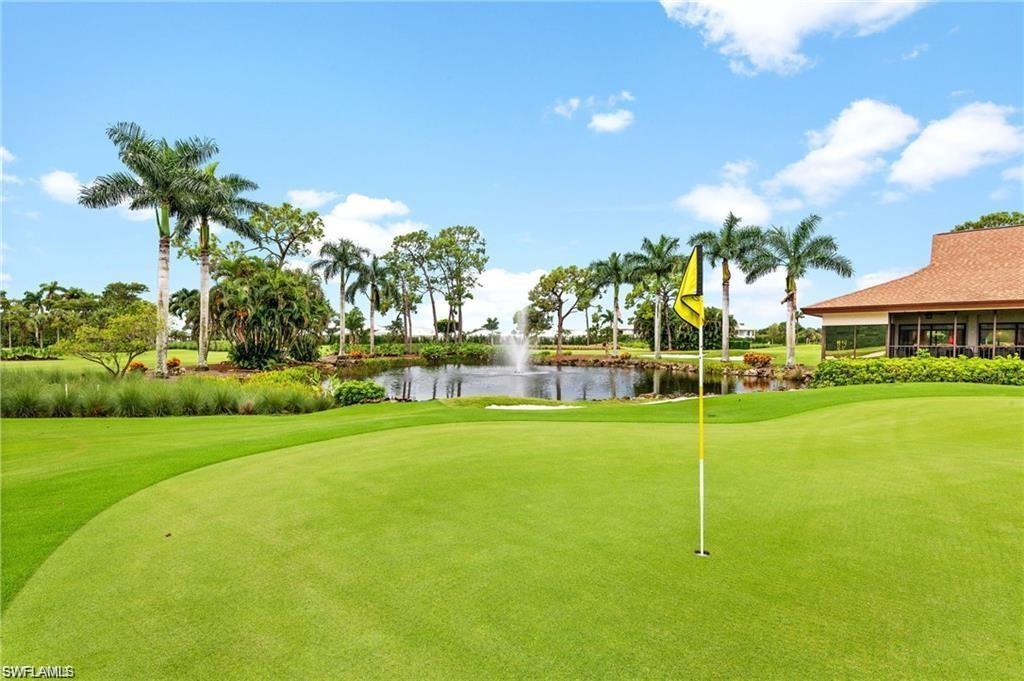 348 Tern Drive, Unit 2 Naples, FL 34112 - Photo 25 of 28 a view of a house with a big yard