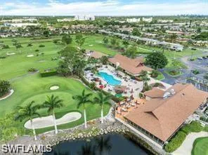 an aerial view of residential houses with outdoor space and swimming pool