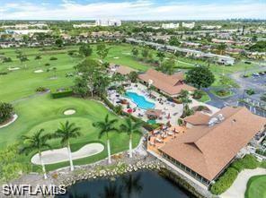348 Tern Drive, Unit 2 Naples, FL 34112 - Photo 26 of 28 an aerial view of residential houses with outdoor space and swimming pool