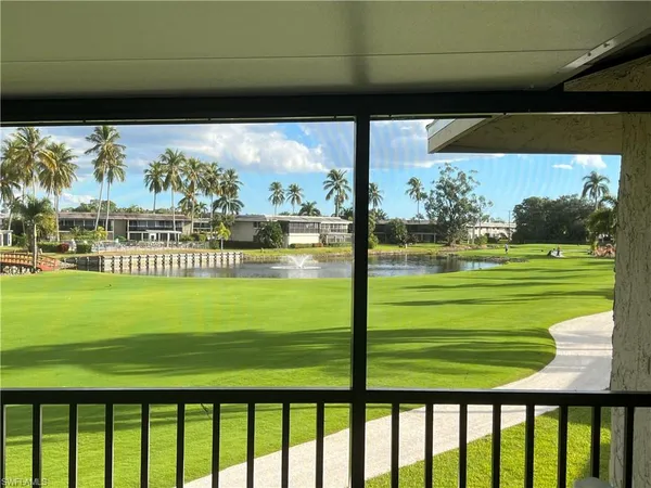 a view of a room with a big yard