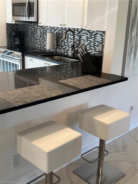348 Tern Drive, Unit 2 Naples, FL 34112 - Photo 7 of 28 a view of kitchen and counter top space
