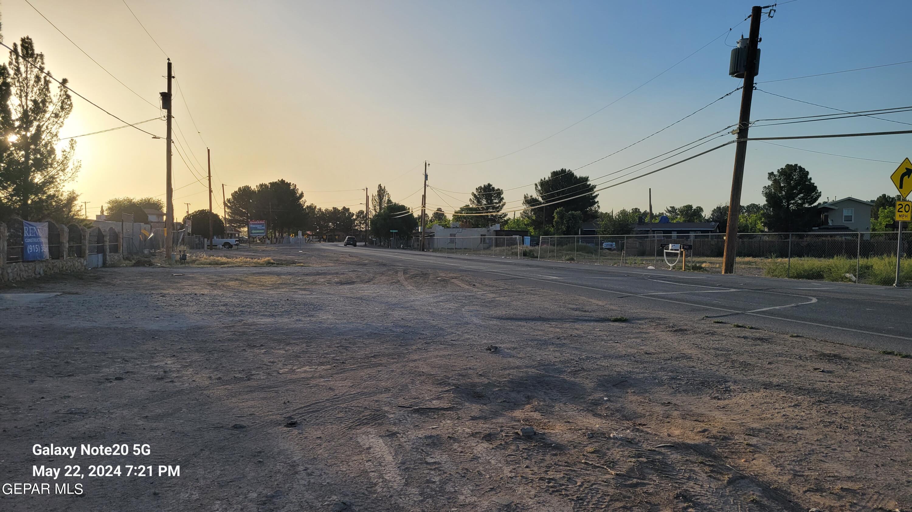 12940 Cuadrilla Road San Elizario, TX 79849 - Photo 4 of 22 a view of a road in the middle of a yard